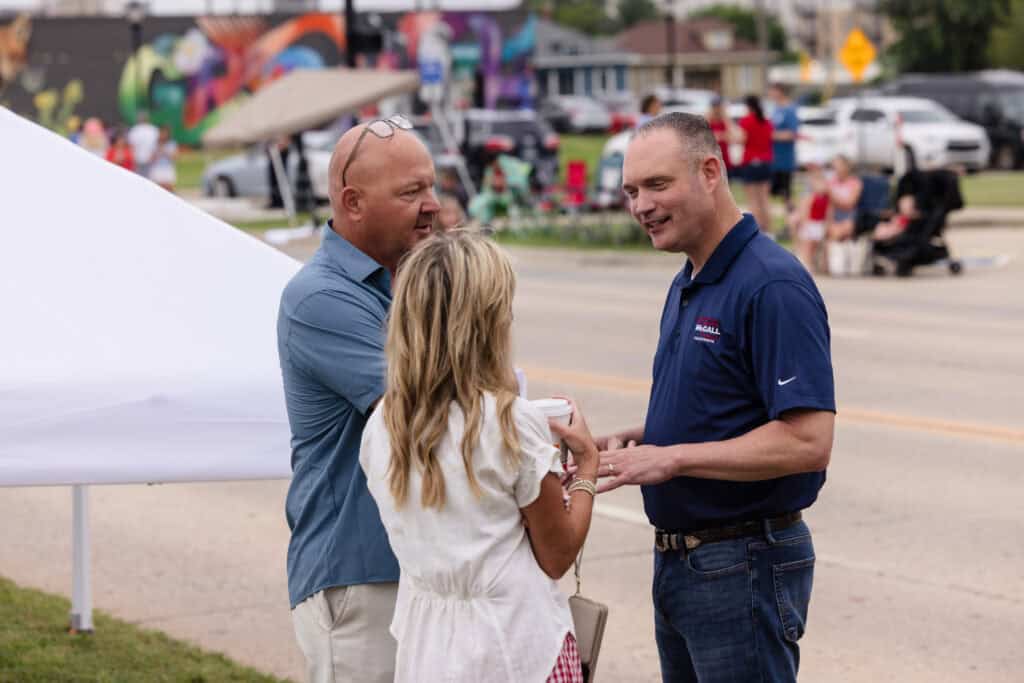 Charles McCall engaging with supporters at a community event.