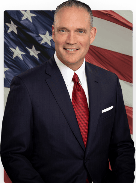 Charles McCall for Governor candidate portrait with American flag background.