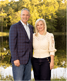 Charles McCall for governor campaign photo with supporter outdoors.