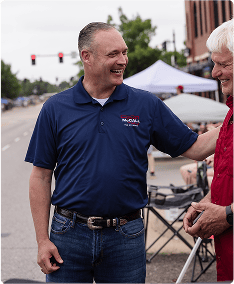 Charles McCall greeting supporter at campaign event for governor.